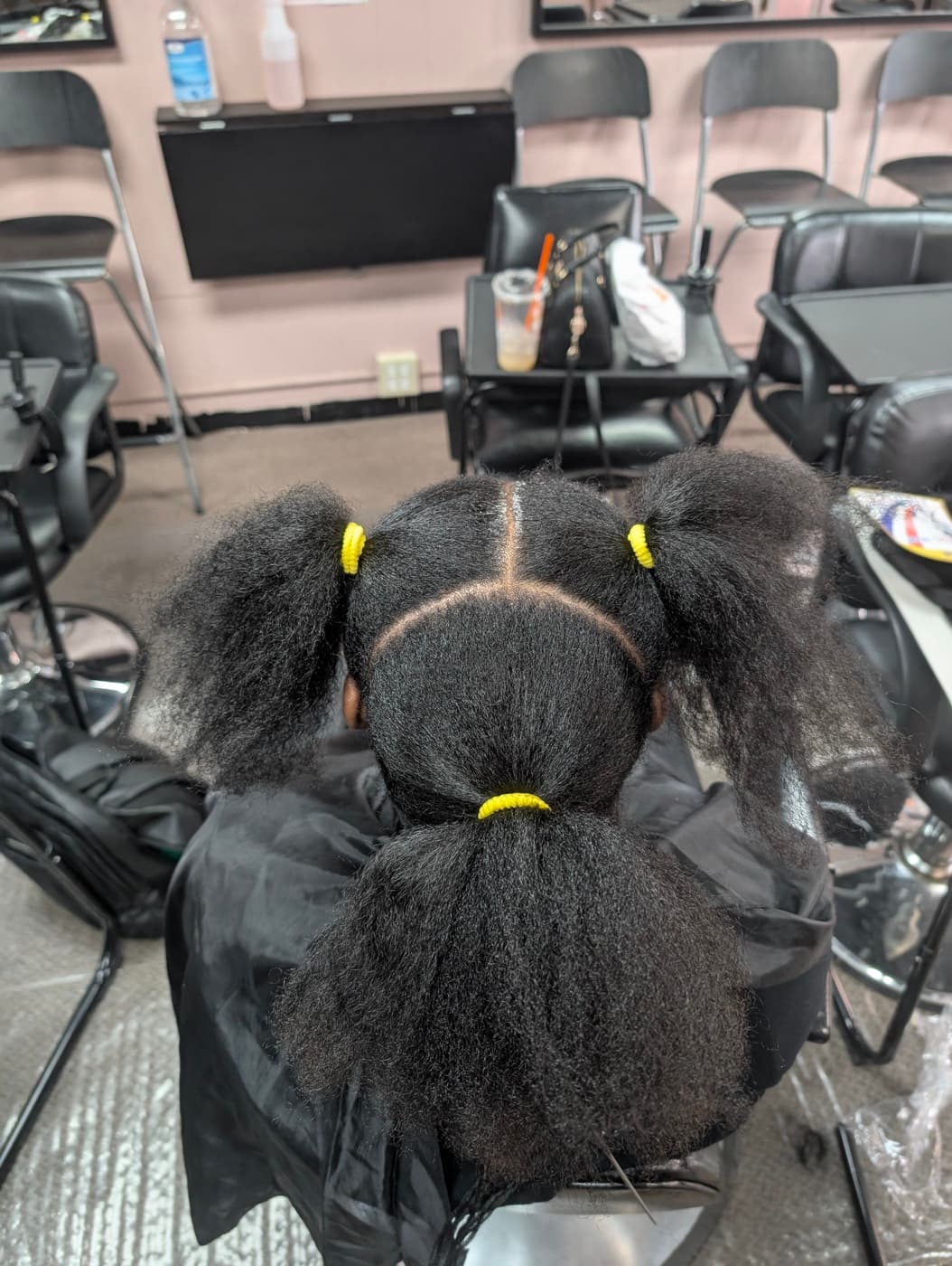 Client hair sectioned and prepped before braiding