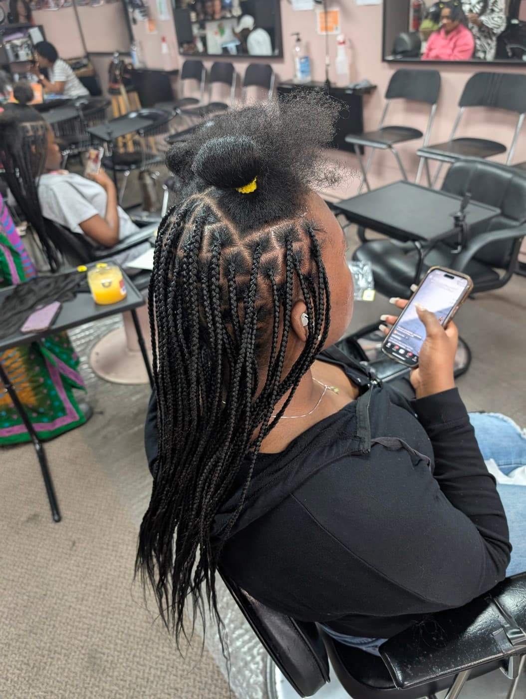 Knotless braids in progress showing technique