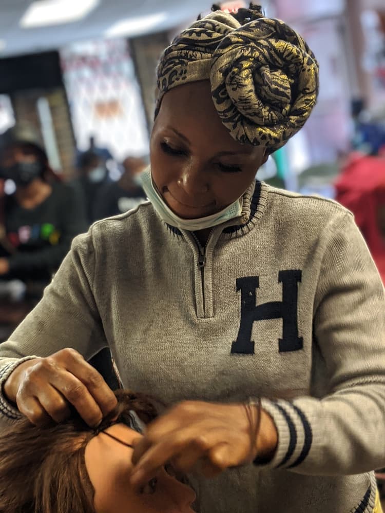 Close-up of braiding technique on mannequin head